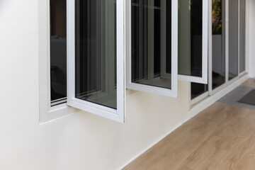 Custom-fit casement window installed on a modern home in Kalamazoo, MI by Worthy Construction, offering improved ventilation and energy savings