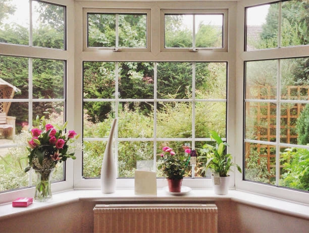 Professional installation of a bay window replacement in a modern family home
