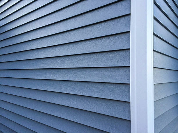 Close-up view of vinyl siding panels installed with clean, uniform lines