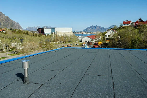 Close-up of flat roof surface with waterproof membrane installed by roofing crew