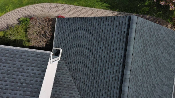 Close-up of roof flashing along the edge of a shingle roof