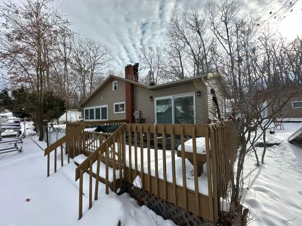 Home with brand-new roof replacement in architectural shingles