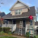 Local roofing contractor working on a residential roof in Kalamazoo