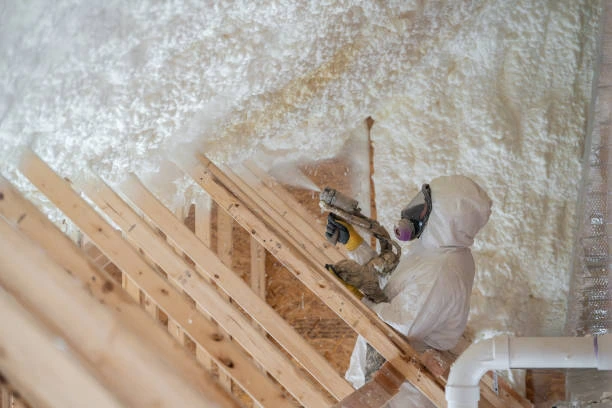 Professional insulation services being performed in a home attic