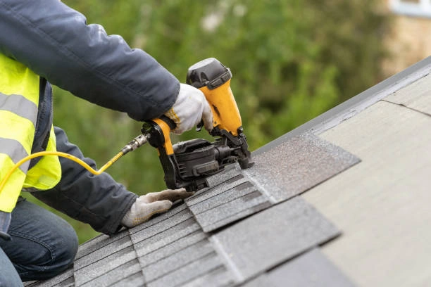 Close-up of shingles being replaced during roof repairs