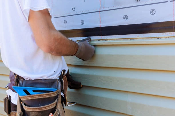 Siding Company - Professional crew installing new fiber cement siding on a residential property
