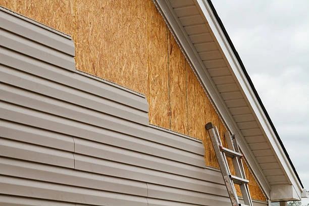 Newly completed siding installation of vinyl siding on a modern two-story home