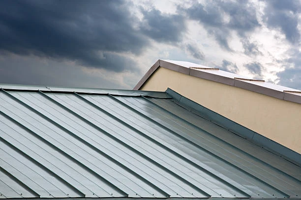 Step flashing being applied during a new roof installation