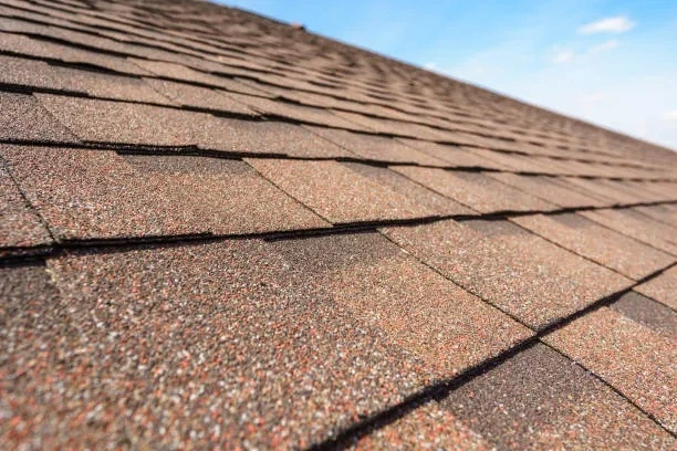 Quality asphalt shingles offering excellent weather resistance and enhancing home curb appeal.