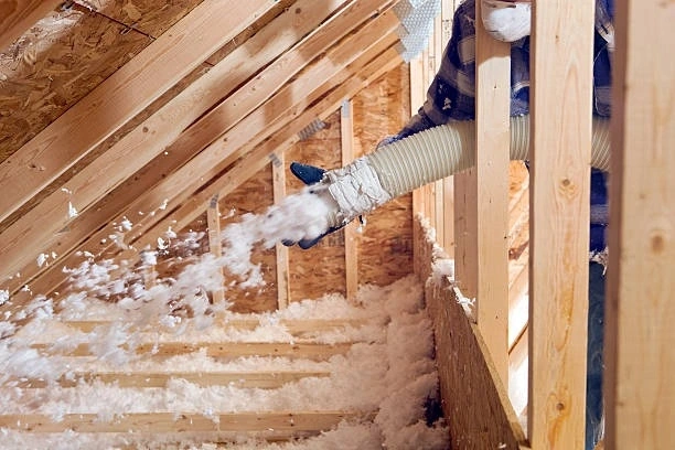 Attic insulation installation to improve energy efficiency and maintain comfortable indoor temperatures.