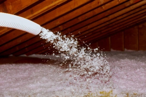 Attic insulation installation to improve energy efficiency and maintain comfortable indoor temperatures.