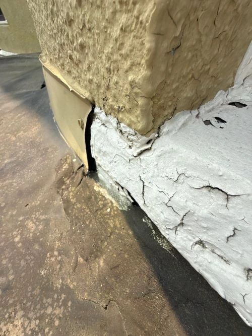 Detailed view of roof flashing installation around a chimney to stop leaks, ensure durability, and protect your home