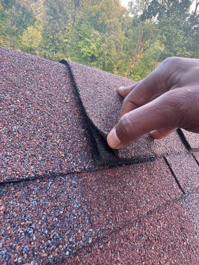 Expert roofer performing roof leak detection to quickly identify hidden leaks and prevent costly water damage