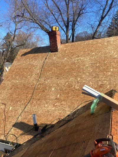 Skilled roof replacement contractors installing high-quality shingles to improve protection, value, and curb appeal.