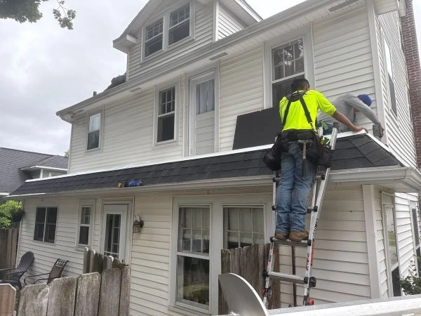 Damaged shingles and water-stained ceiling showing costly effects of delaying roof repairs.