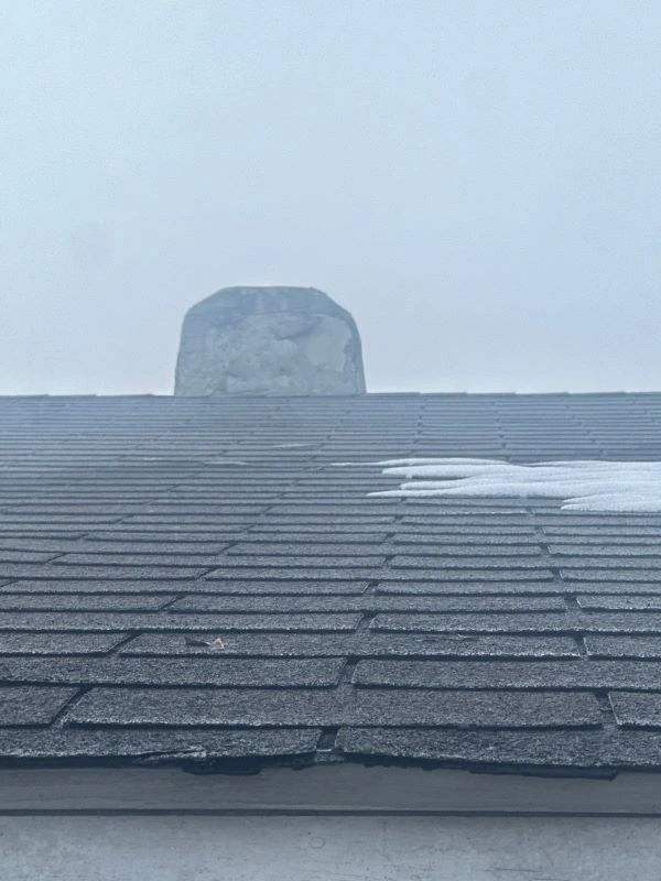 Water stains on a white ceiling caused by winter roof leaks after snow, inspected by Worthy Construction LLC