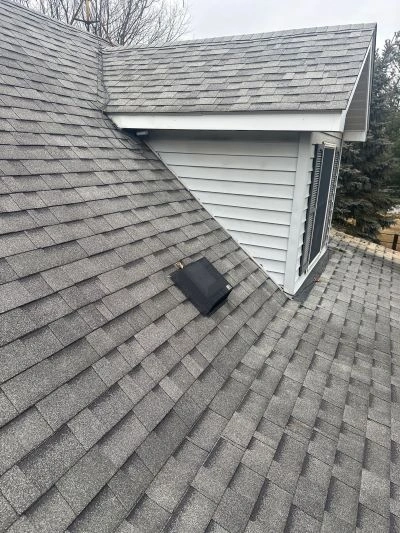 Attic interior with open rafters and vents demonstrating proper attic ventilation for winter, installed by Worthy Construction LLC to prevent moisture damage and roof problems.