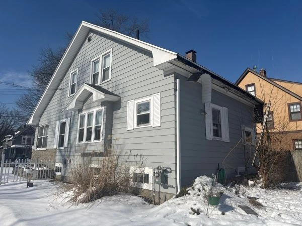Midwest home roof showing worn shingles and weather damage from UV exposure, wind, moisture, and freeze thaw cycles that make roofs age faster.