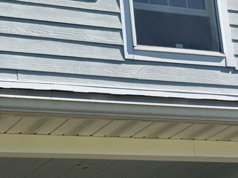 Gutter seam separation causing leaking gutter joints and separated gutter corners on a home exterior.