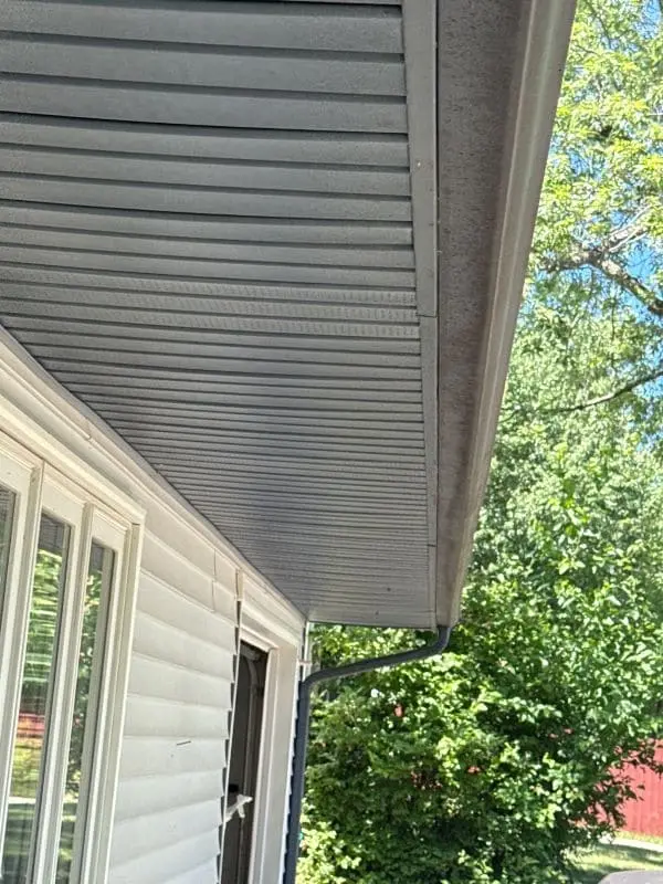 Gutter make noise during heavy rain as water drips loudly through a home gutter system.