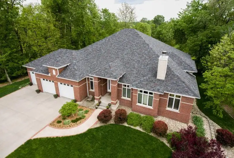 Residential home with durable Malarkey shingles installed by Worthy Construction LLC.